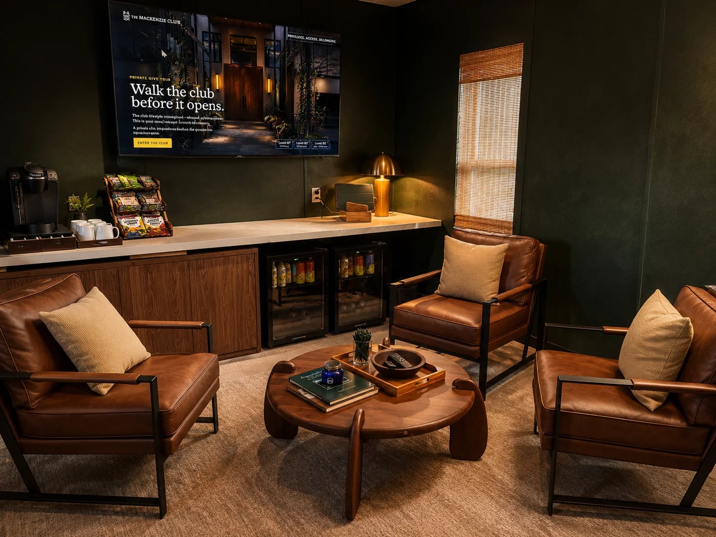 Leather chairs, refreshments, and a presentation screen inside the temporary Mackenzie membership office