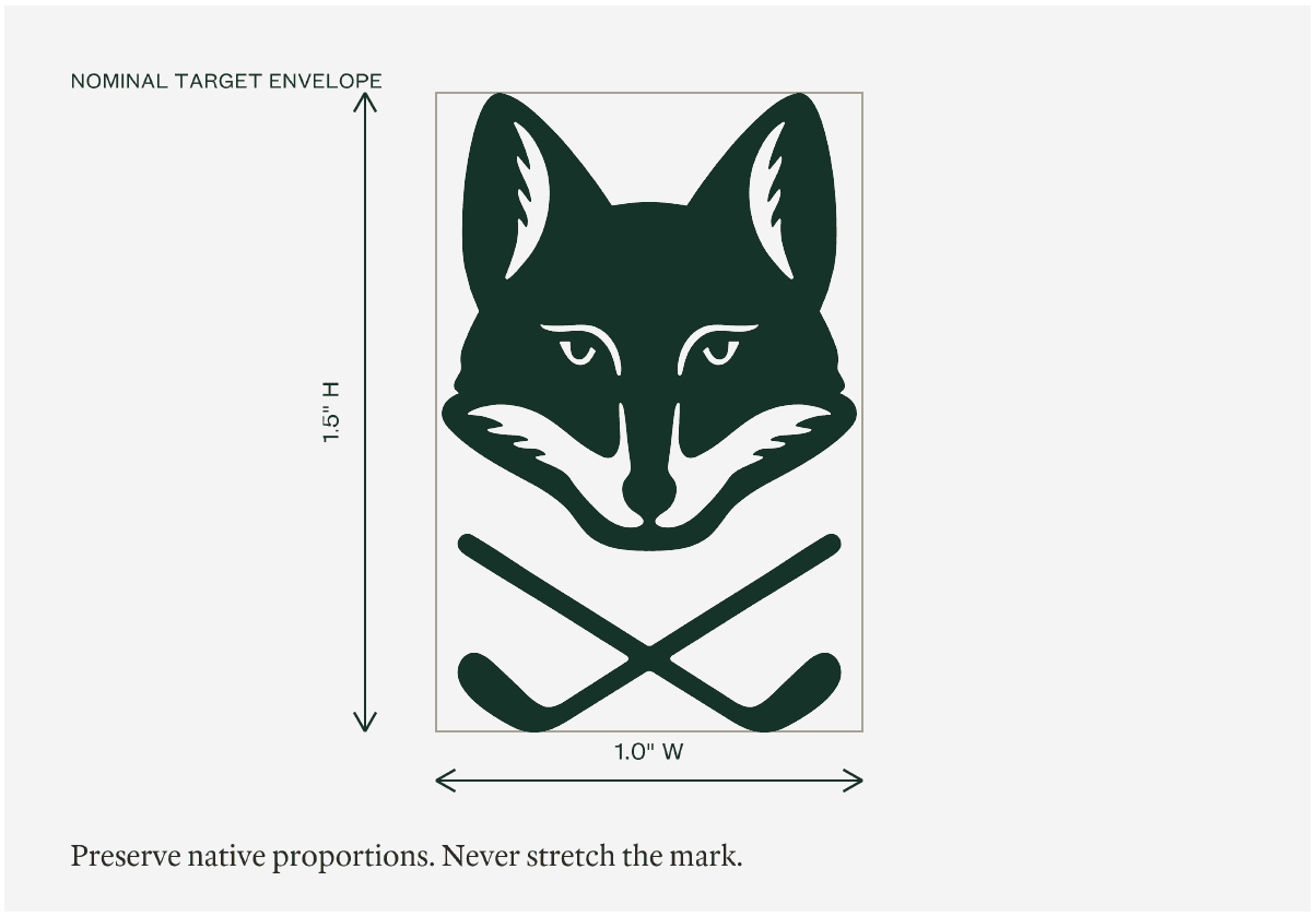 Diagram showing the fox-and-clubs mark fitting proportionally inside a 1.5 inch high by 1.0 inch wide embroidery target envelope